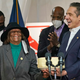 New York Gov. Andrew Cuomo (R) presents Hazel Dukes, president of the New York State chapter of the NAACP, with a cake to celebrate her birthday at the mass vaccination site at Mount Neboh Baptist Church in Harlem on March 17, 2021 in New York City.